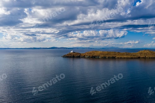 Preview: Greece, Kea Tzia island. Lighthouse on rocky cape, sky, sea background.