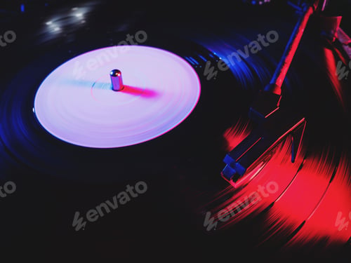 Preview: Movie of retro-styled record player spinning vinyl black record. Cinemagraph. Side view. Beautiful