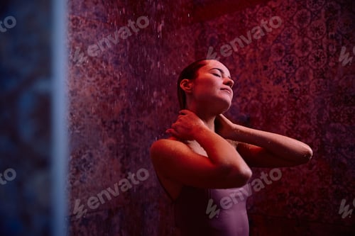 Preview: Young sensual woman taking a shower at the spa.
