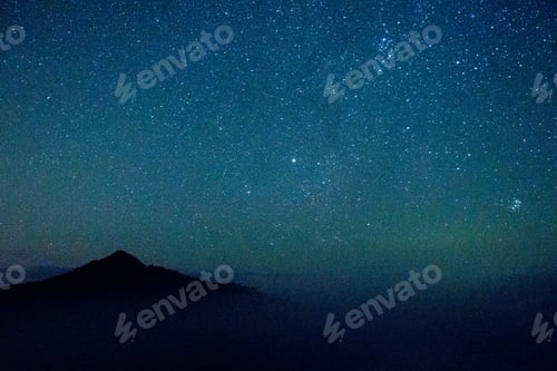 Preview: Beautiful starry blue sky at night against the background of mountains