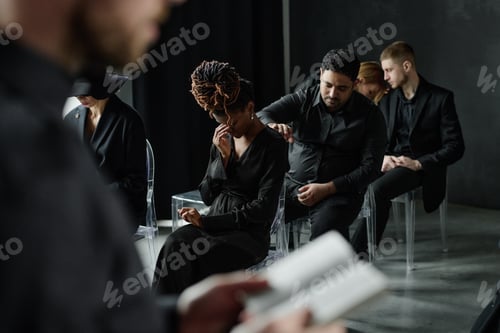 Preview: Multiethnic Adults Comforting Grieving Woman during Emotional Group Therapy