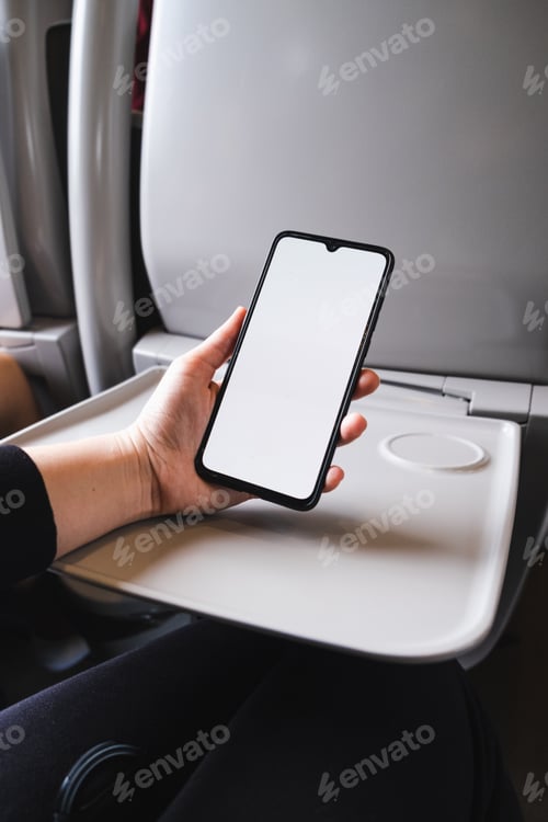 Preview: Woman using smartphone on train