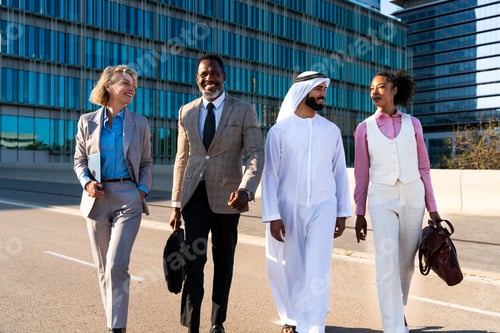 Preview: Group of multiethnic business people meeting an emirati businessman