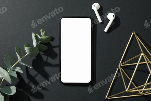 Preview: Phone with empty screen on black decorated background, top view