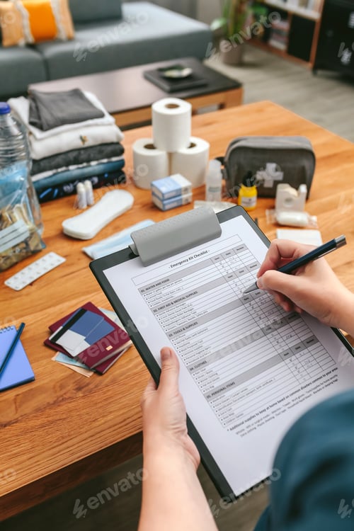 Preview: Woman doing checklist of emergency backpack