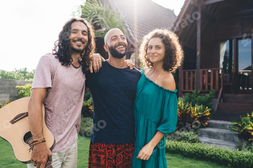 Preview: Cheerful diverse friends with guitar