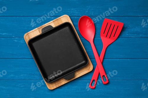 Preview: Set of modern cooking utensils on blue wooden table, flat lay