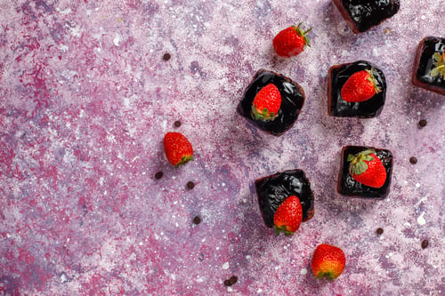 Preview: Chocolate cake bites with chocolate sauce and with fruits,berries.