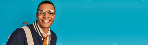 Preview: happy african american student in stylish jacket and eyeglasses on blue, banner, copy space