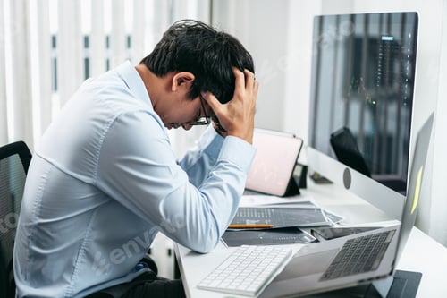 Preview: Businessman investor working and stress with computer analyzing graph stock market trading planning