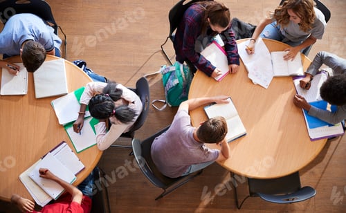Preview: Overhead Shot Of High School Pupils In Group Study Around Tables