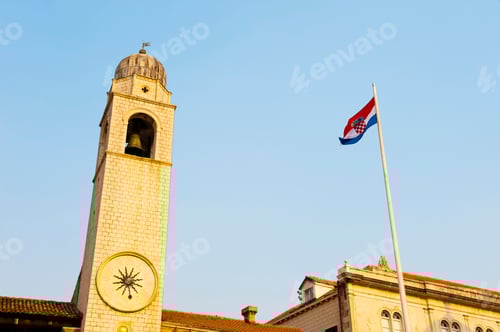 Preview: Clock Tower and Croatian Flag Against Blue Sky