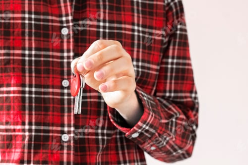 Preview: a close up agent house seller hand hold and give the new mansion keys, isolated, simple move concept