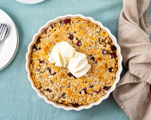 Preview: Whole apple and pear crumble with ice cream, streusel. Sweet dessert with stewed fruit, top view