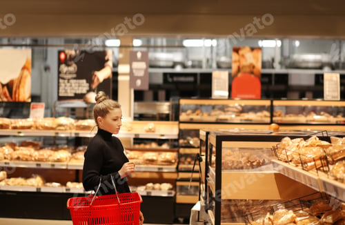 Preview: Woman Choosing Bread From A Supermarket