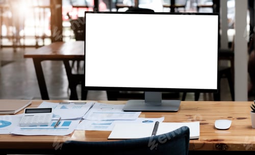 Preview: Computer laptop with white blank screen putting on wooden working desk that surrounded by coffee cup