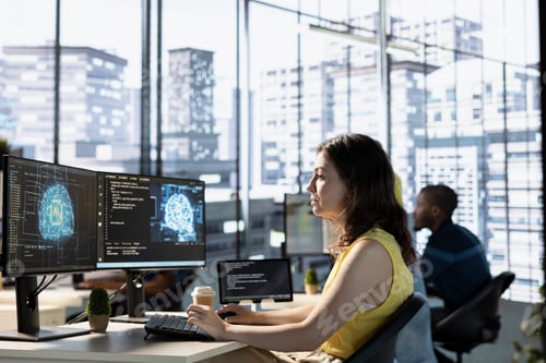 Preview: IT specialist in office analyzing and interpreting complex AI data