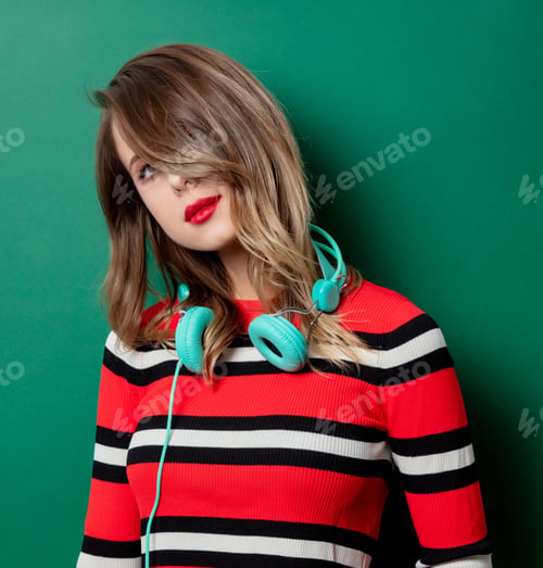 Preview: Woman in striped sweater with headphones