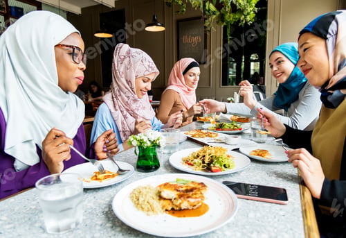 Preview: Islamic women friends dining together with happiness