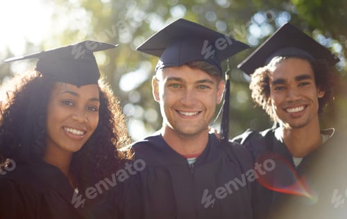 Preview: Graduation day. Portrait of three happy students on graduation day.