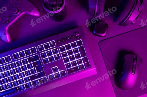 Preview: White lit keyboard surrounded by various modern wireless gadgets