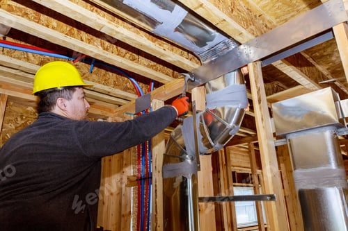 Preview: Workers making final air duct conditioning HVAC system ventilation pipes stands for heating