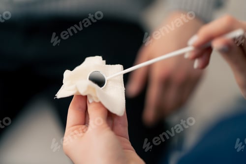 Preview: close-up in clinic young doctor ear throat nose ready to examine the patient