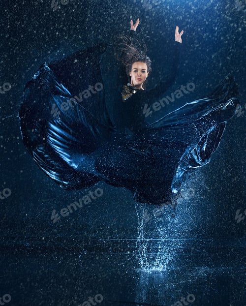 Preview: The young beautiful modern dancer dancing under water drops