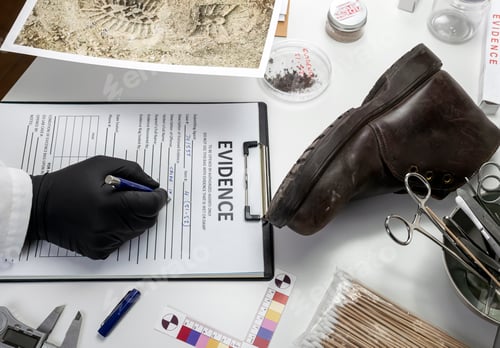 Preview: Police scientist investigates a shoe sole tape tread involved in crime lab murder, concept image