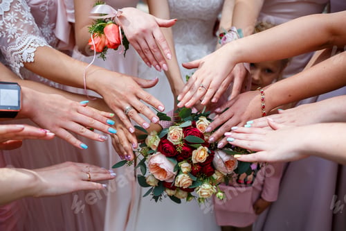 Preview: Beautiful wedding bouquet of flowers in the hands of the newlyweds
