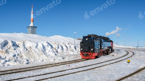 Preview: Steam train during winter in the snow in the Harz Germany Brocken Bahn