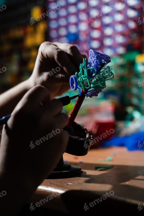 Preview: Close up of joining wax models in jewelry workshop.