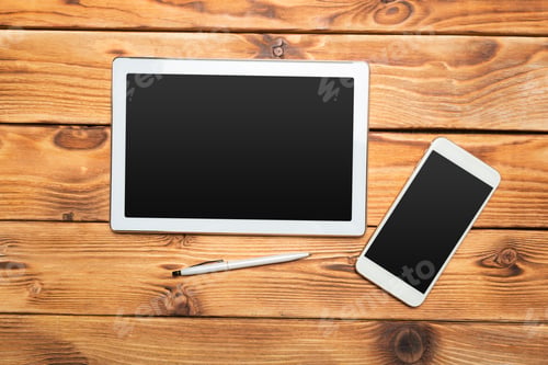 Preview: White digital tablet on wooden table