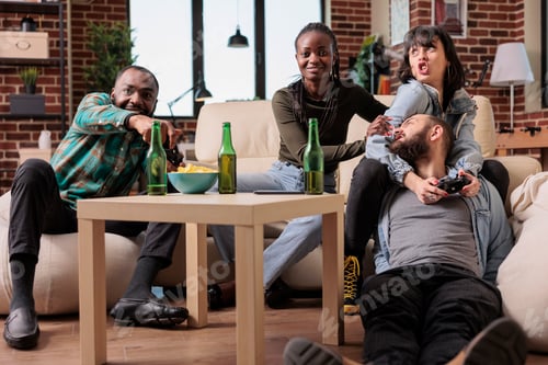 Preview: Multiethnic group of people feeling happy and playing video games