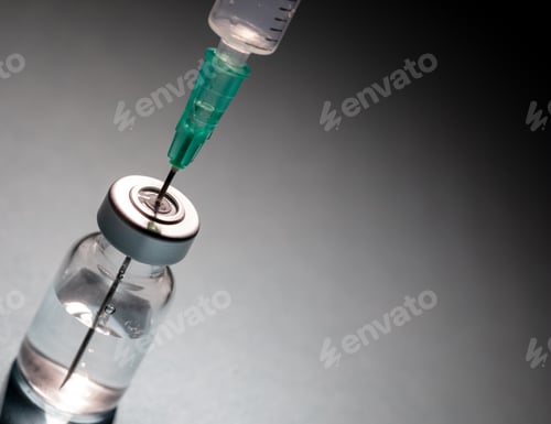 Preview: Vaccine vial dose and syringe against gray background