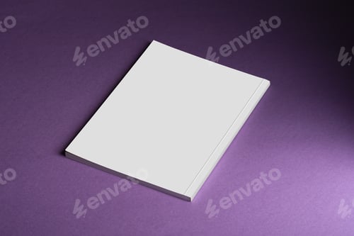 Preview: Close-up shot of a book with a blank cover on a purple backdrop.