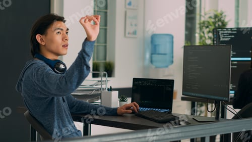 Preview: Software programer writing code and using holographic program with augmented reality