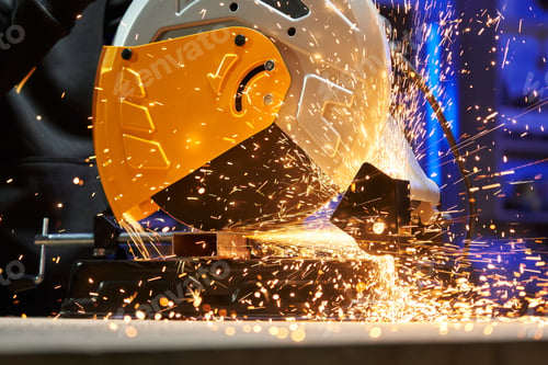 Preview: close-up disc cutting machine cuts a metal profile. a lot of sparks fly out from under the