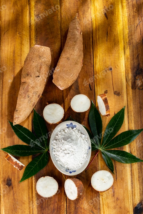 Preview: pile of cassava, cassava and cassava flour on a background of rustic wood (Manihot esculenta)