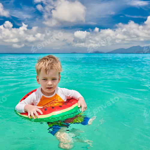 Preview: Three Year Old Toddler Boy On Beach At Seychelles Swimming With Inflatable Ring