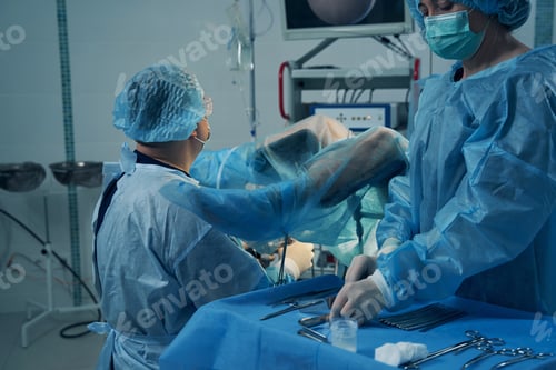 Preview: Woman with covered legs undergoing hysteroscopy in clinic