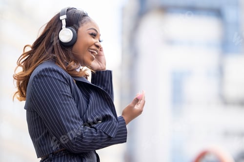 Preview: Close up of woman listening to music with headphones
