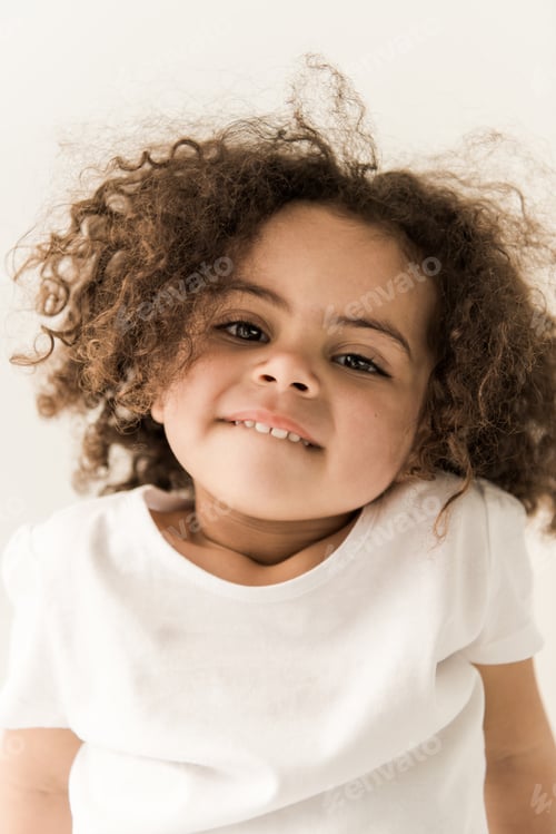 Preview: Cute curly african american baby girl, close-up portrait