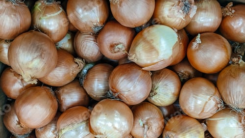 Preview: Fresh and ripe onions on the market. Background.