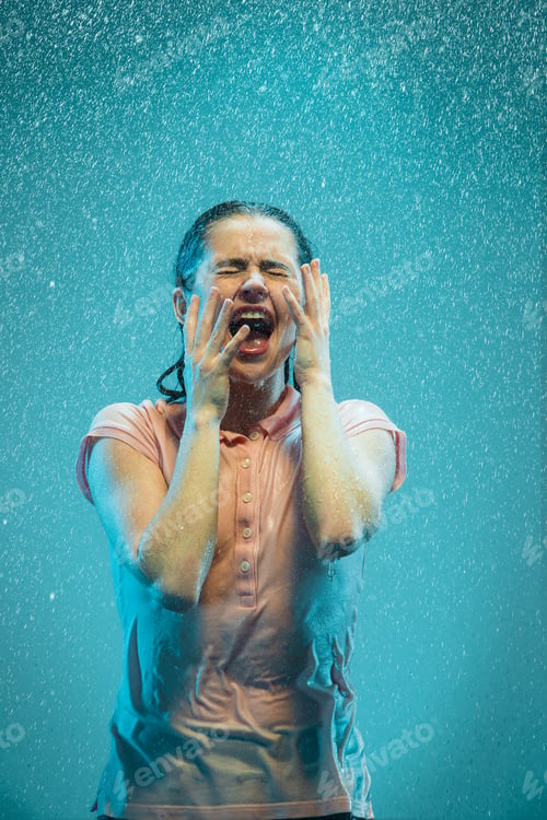 Preview: The portrait of young beautiful woman in the rain