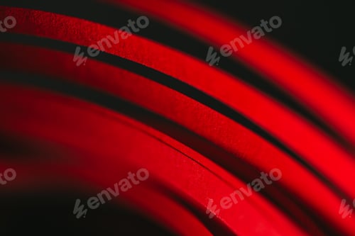 Preview: close up view of red quilling striped paper on black