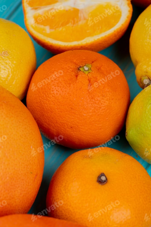 Preview: close-up view of citrus fruits as orange lemon and tangerine on blue background