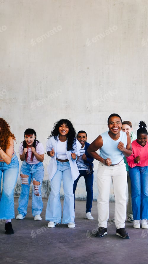 Preview: Diverse friends dance to music song for viral social media video. Young people celebrating. Vertical