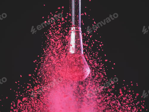 Preview: Make-up brush with pink powder explosion on black background