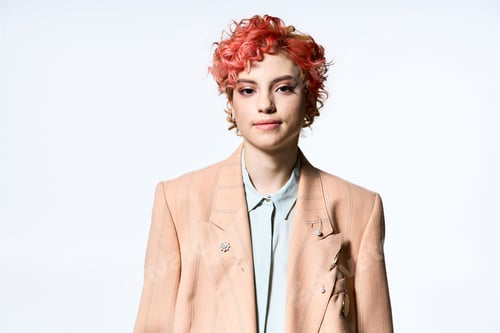 Preview: Scarlet Elegance: Red-Haired Woman in Stylish Jacket